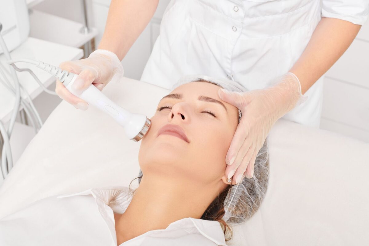 Patient receiving a facial rejuvenation treatment to correct unwanted facial rejuvenation results and restore a natural appearance.
