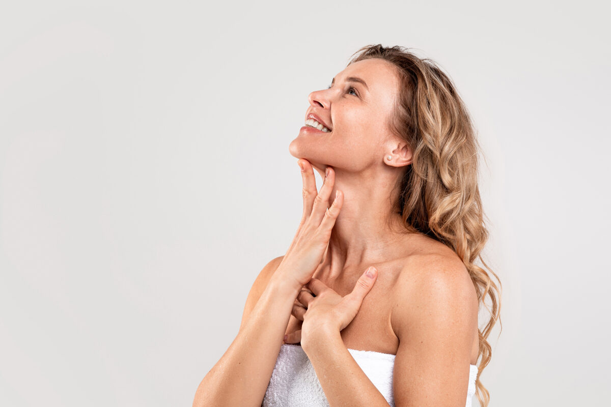 Woman enjoying smoother, lifted skin after a non-surgical facelift in Oklahoma City using PDO thread treatment.