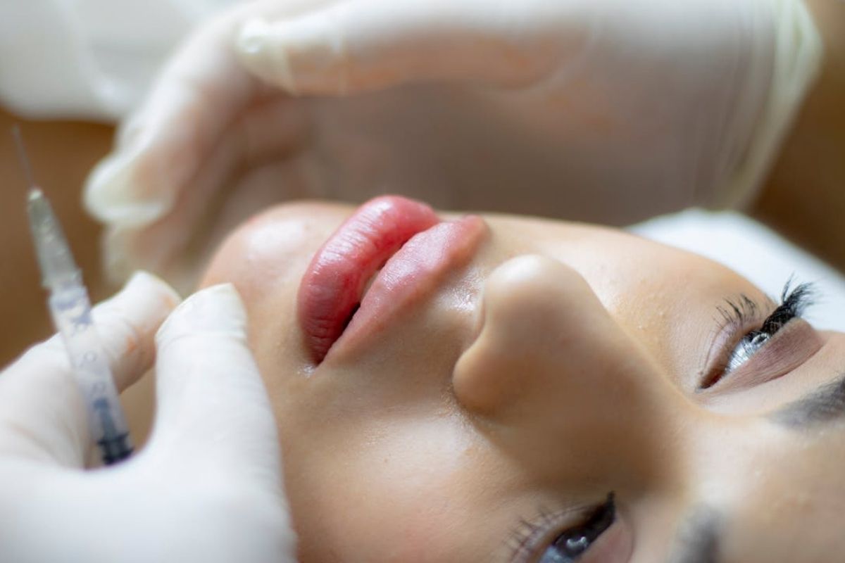 Patient receiving a Dysport treatment to smooth facial lines during a cosmetic injection appointment.