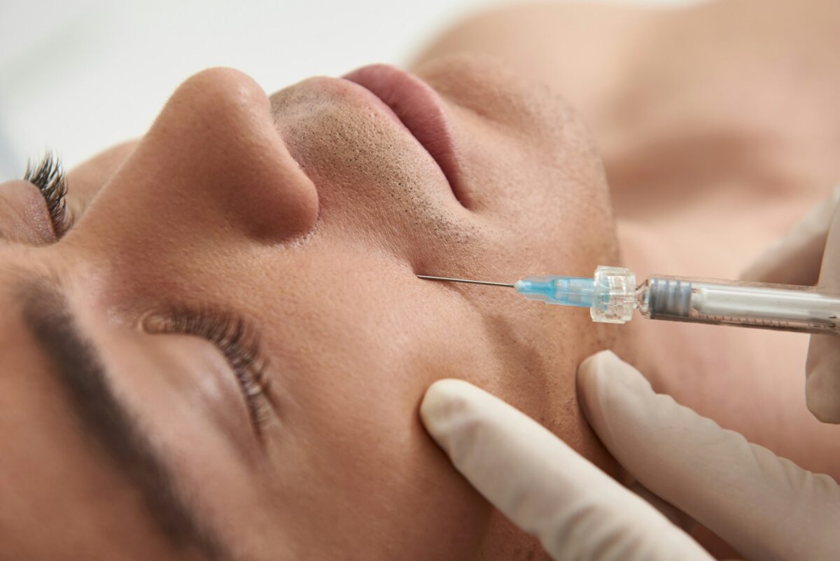 Dermal injections being administered to the cheek to restore facial volume and reduce signs of aging.