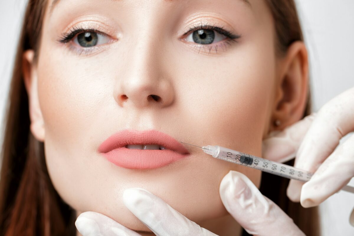 Provider performing volumizer fillers to enhance natural lip volume and facial balance.
