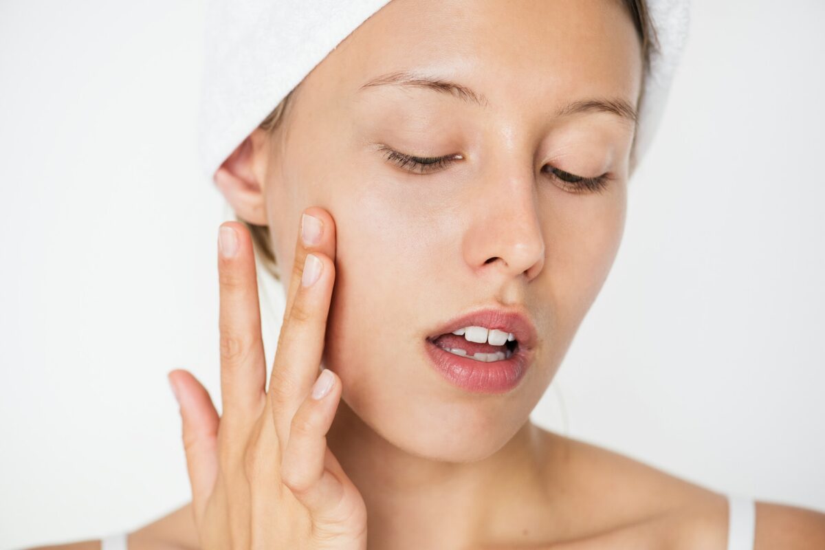 Woman with healthy, glowing skin after a chemical peel treatment that improves skin tone and texture.