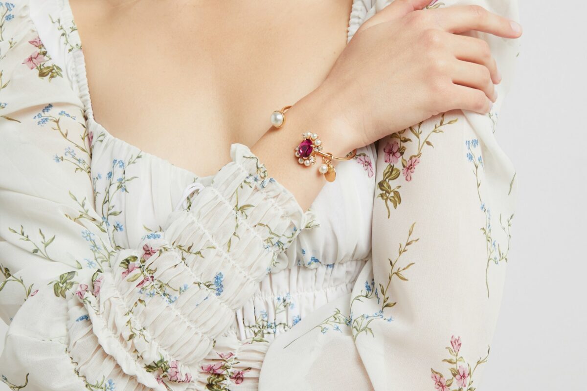 Woman wearing a floral dress after breast implant removal, representing confidence and healing following surgery.