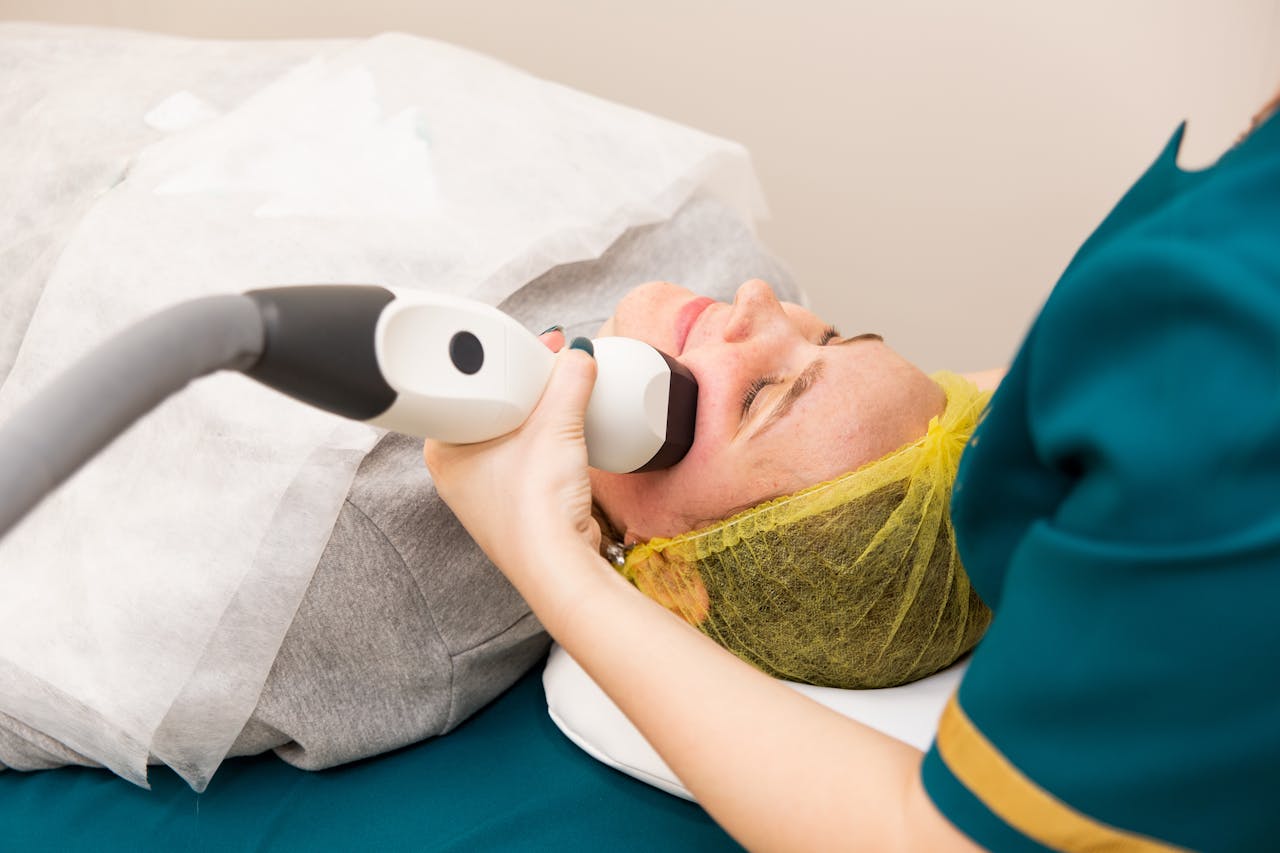 Patient receiving a non-surgical facial rejuvenation treatment to refresh skin texture and appearance.