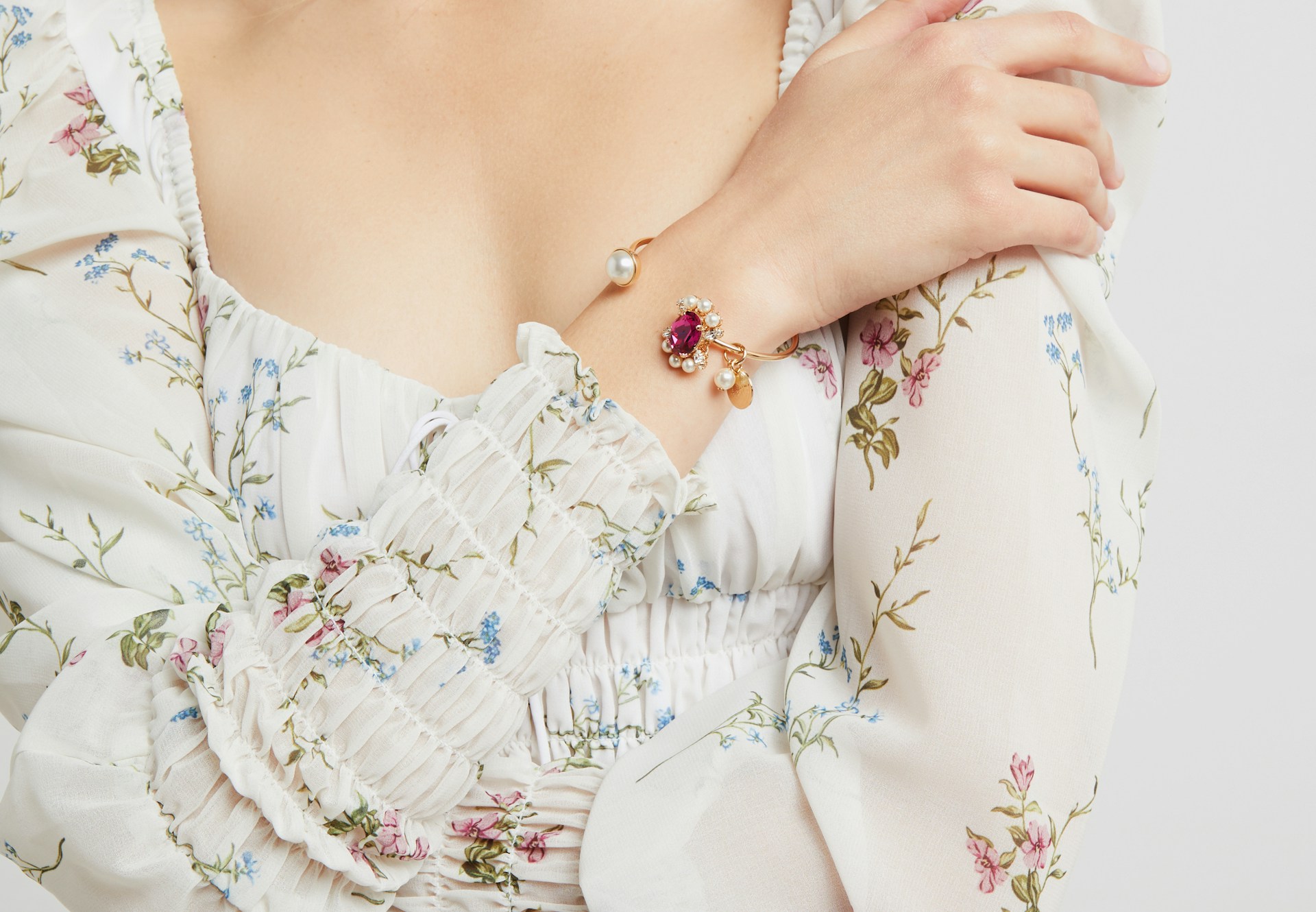 Woman in a floral top representing personal confidence and decision-making around breast implant removal.